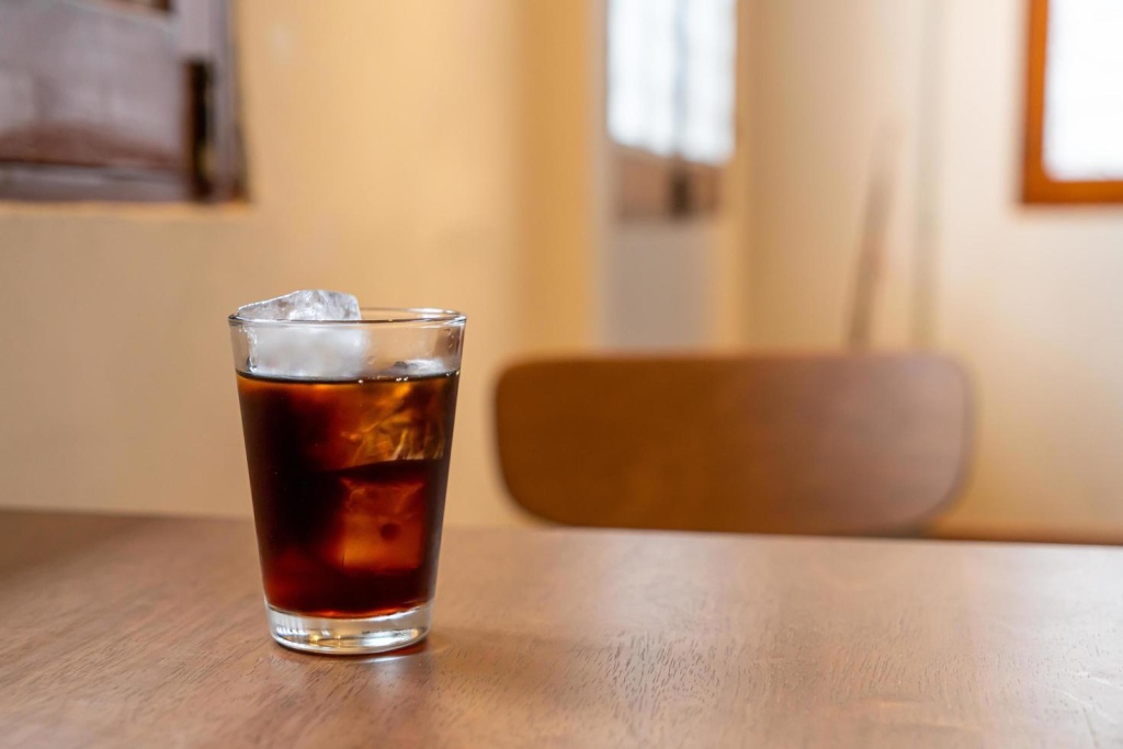 cold-brew-coffee-glass-with-ice-cube-on-wood-table-free-photo.jpg