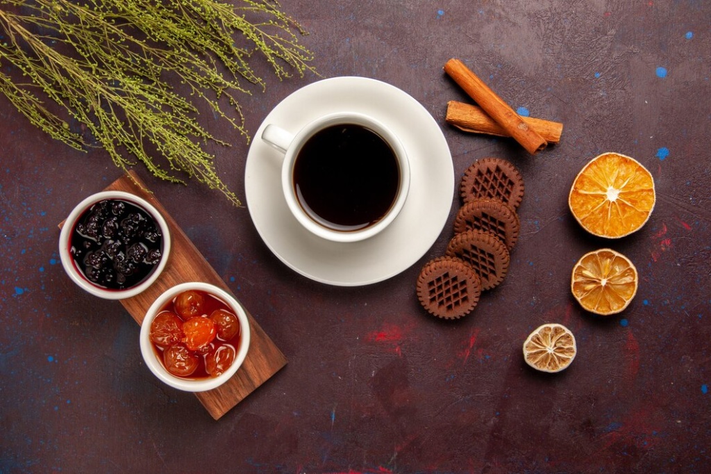 top-view-cup-coffee-with-different-jams-chocolate-cookies-dark-desk-fruit-jam-marmalade-sweet_140725-55705.jpg